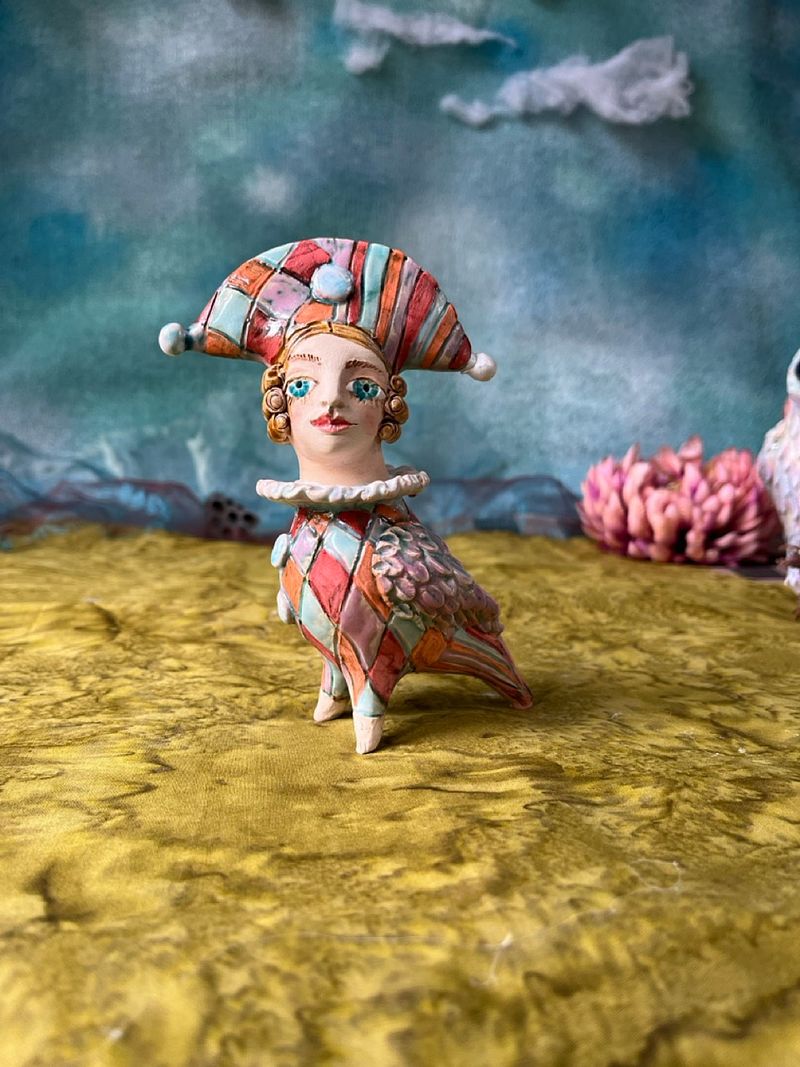 Harlequine Bird. Tiny sculpture
