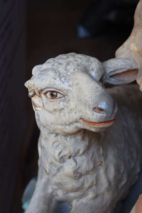 antique plaster statue lamb with broken ear