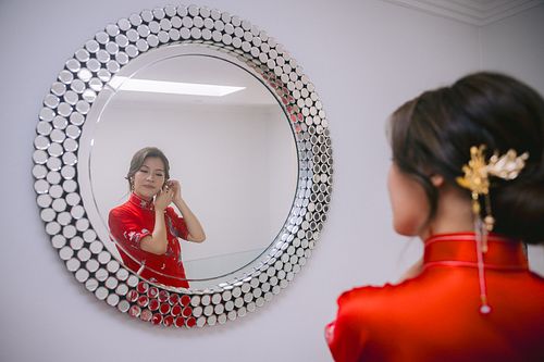 Chinese bride getting ready for traditional tea ceremony