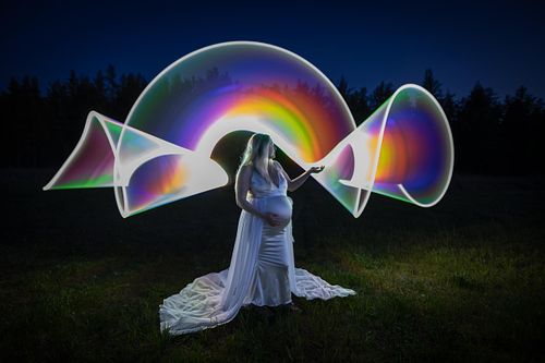 Light painted portrait of expecting mother.