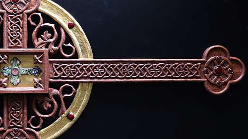 close up picture of the carving on the reliquary after stain and gilding