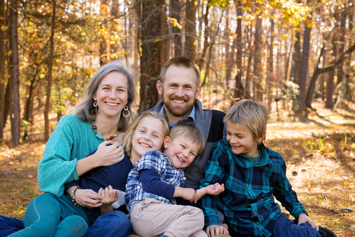 A family at Dr. Martin Luther King Jr. Park in Carrboro at golden hour
