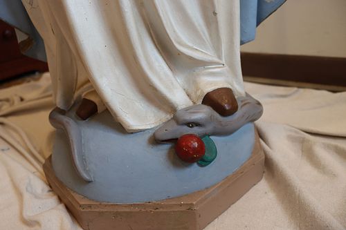 Snake at bottom of Mary statue before restoration