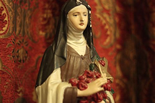 The small statue of St. Therese before restoration - showing her roses and crucifix