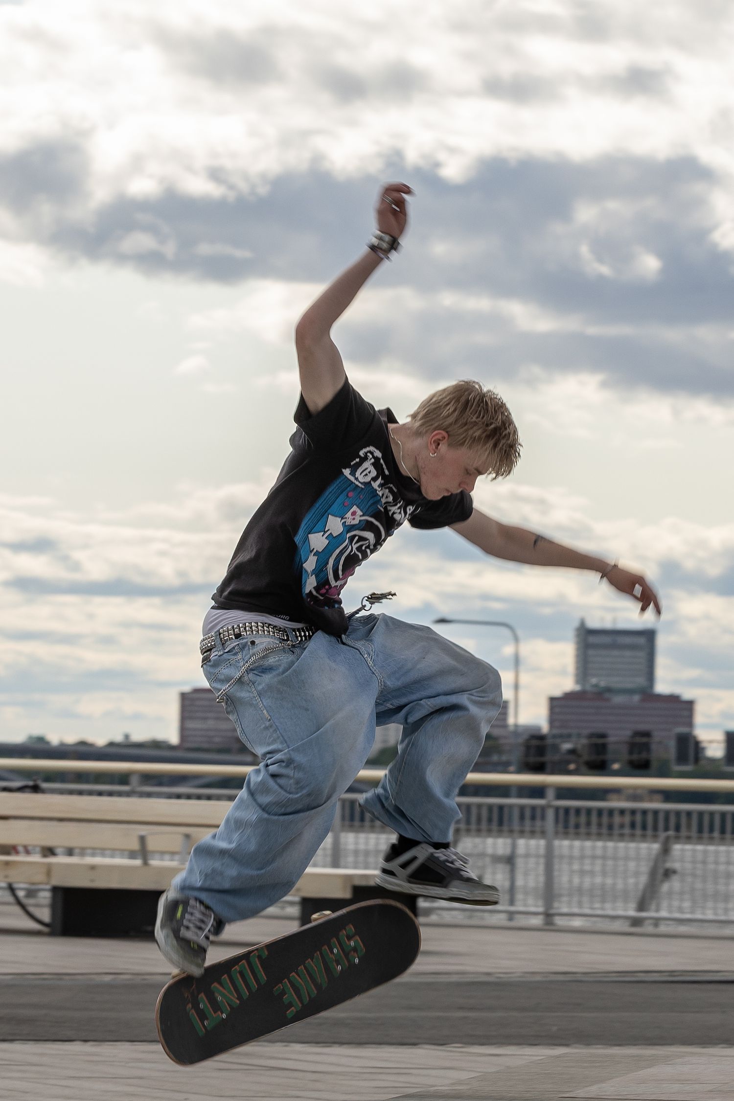 Action portrait of a skateboarder mid-jump in an urban setting, photographed in Stockholm by Mats Karlsson.