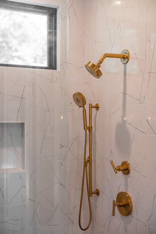 Satin brass shower fixtures