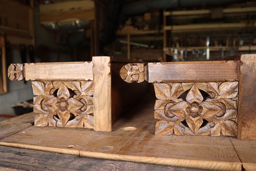 detail of the hand-carved flowers after stain and finish