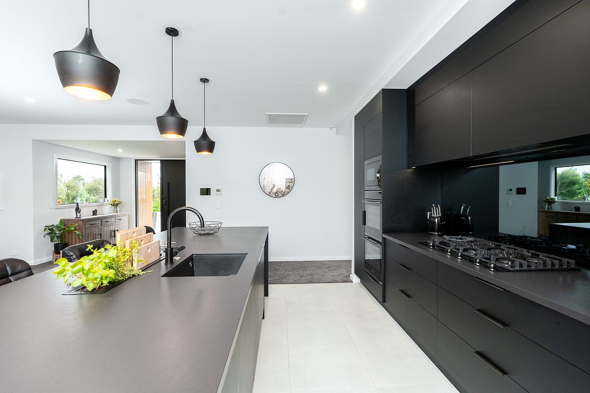 High-end architectural photography of a bespoke kitchen and island in Tamahere by Flax Cove Studio.