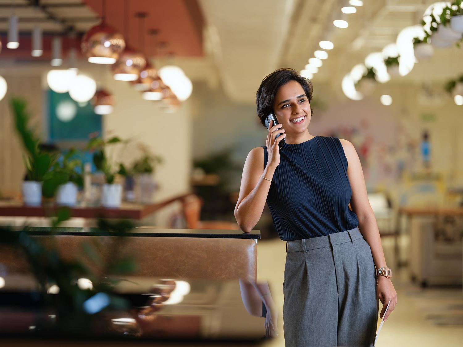 Indian professional woman on a phone call in a modern co-working office space &mdash; corporate lifestyle photography Bangalore by Sudeep Bhattacharya