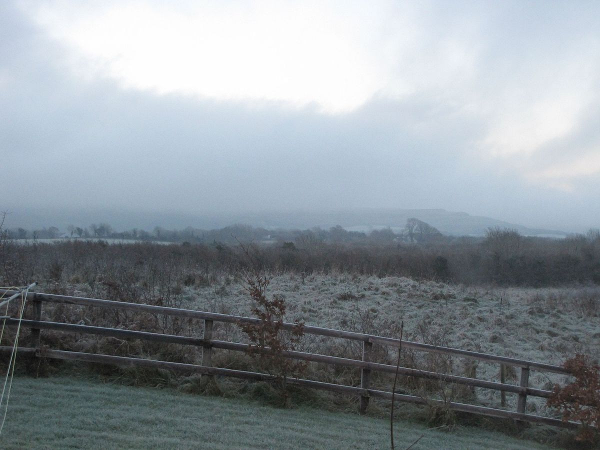 snow over the fields in ballyvaughan, ireland