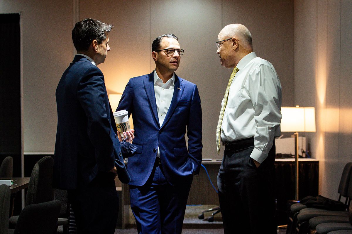 Corporate event photography capturing Governor Josh Shapiro and AFSCME President Lee Saunders speaking backstage during the 2022 AFSCME National Convention in Philadelphia, highlighting leadership, connection, and advocacy.
