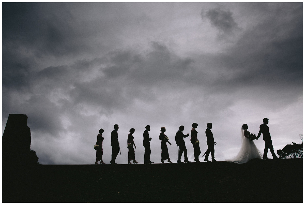 Silhouette photo of the bridal party at Georges Head Lookout, adjacent to Gunners Barracks
