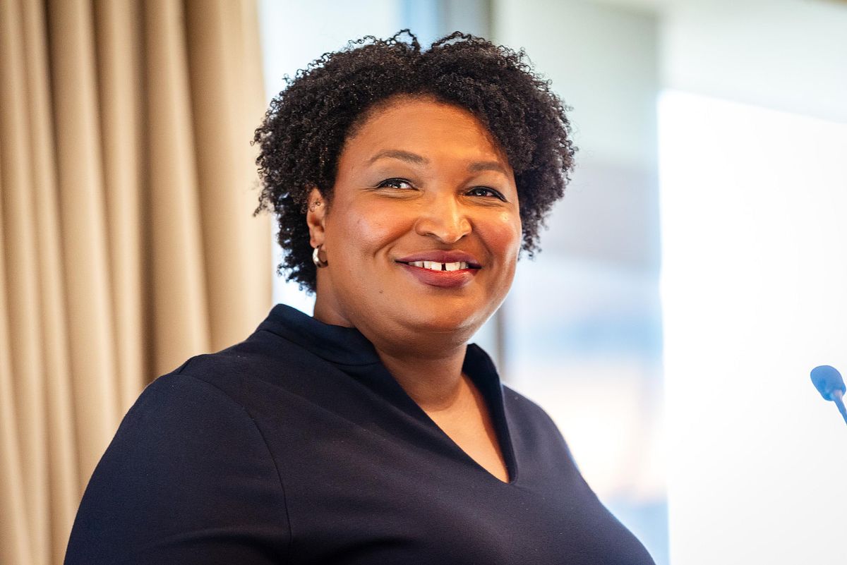Stacey Abrams speaking at a leadership event, captured in close, strategic framing by Philadelphia corporate event photographer Emmages.