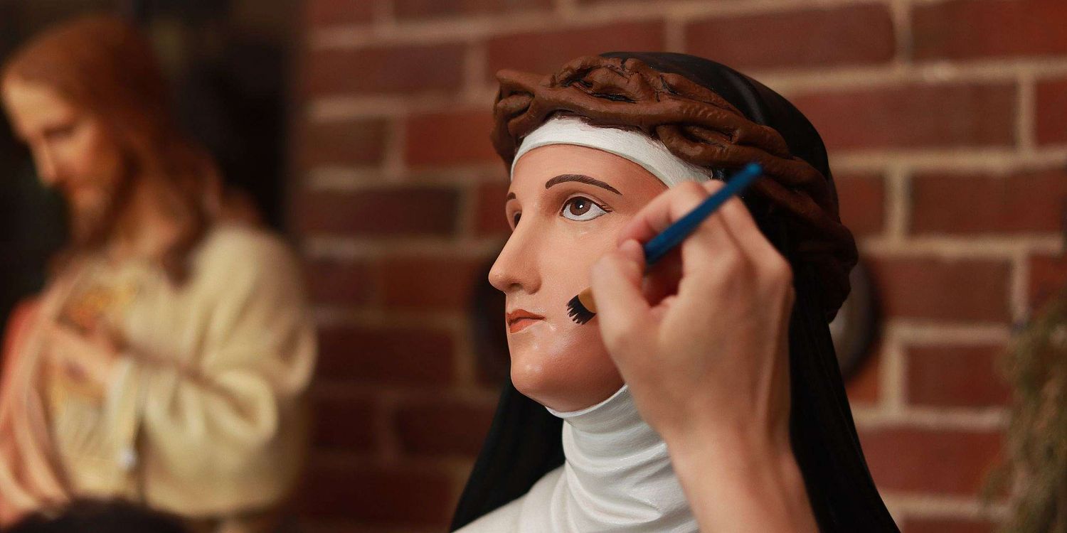 Saint Catherine of Siena Statue Restoration for Holy Trinity Catholic Church in Somerset, Ohio.  Painting by Kelly Baker of Contrasts Woodcarving.