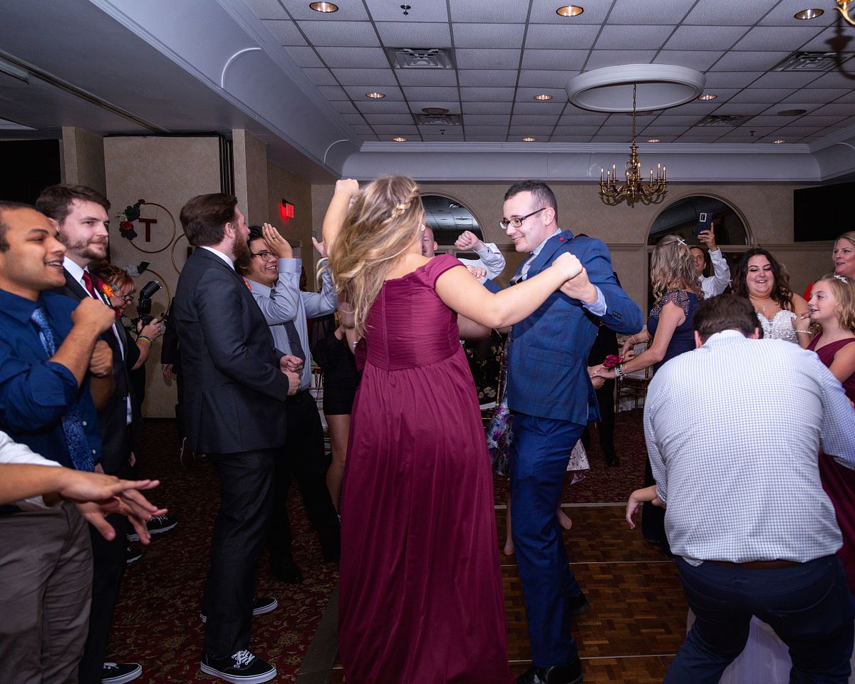 flash photography during wedding reception photographing people dancing