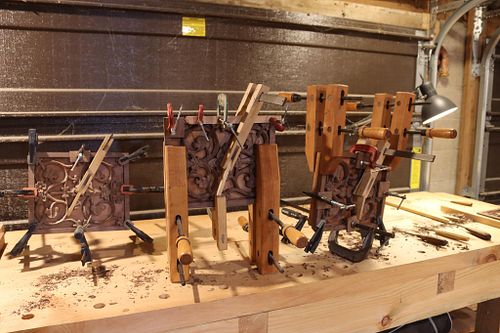 showing the glue up process in the making of the font and the many clamps needed to glue everything up