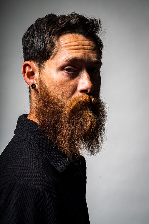 Studio portrait of Tim with softbox and strobe lighting on white background — photographed by David Andrade, Las Vegas