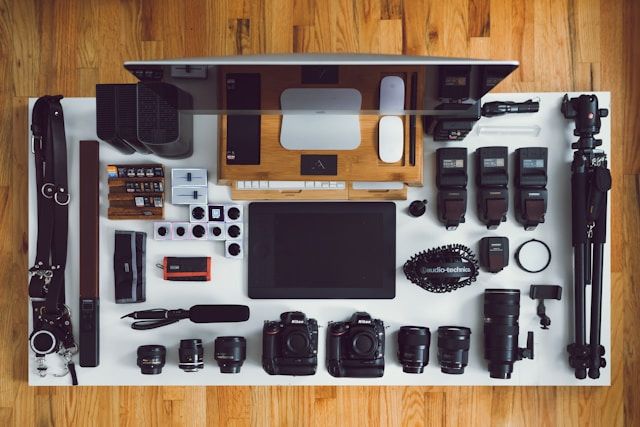 Photography equipment laid out on a desk