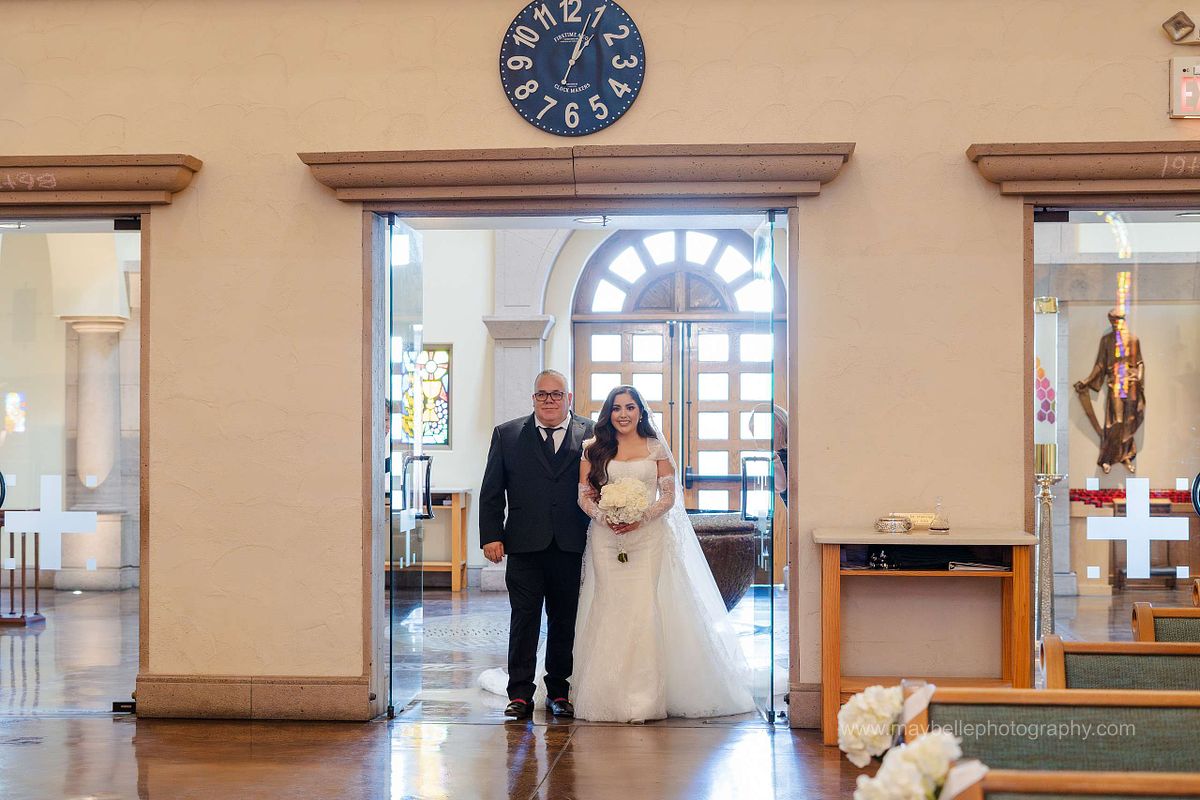 Exchanging vows at Saint Joseph, Husband of Mary Roman Catholic Church in Las Vegas Wedding Photography