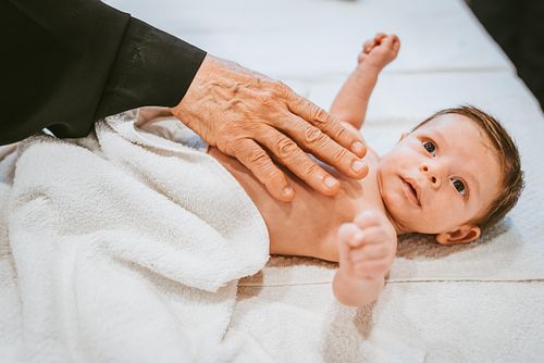 baby baptism ceremony at Ottawa church captured by Kameel Photography