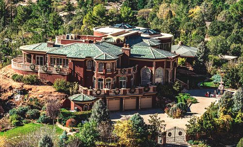 Elegant hillside mansion with exquisite architecture and landscaping.