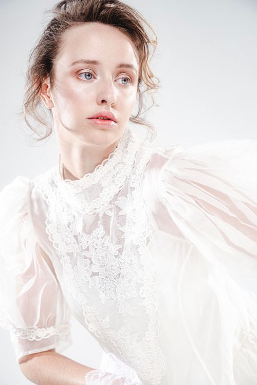 High-end fashion portrait, expressive pose, photographed in studio by Mila Filippone.