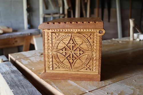low relief carving on side of oak box with Gothic leaf details
