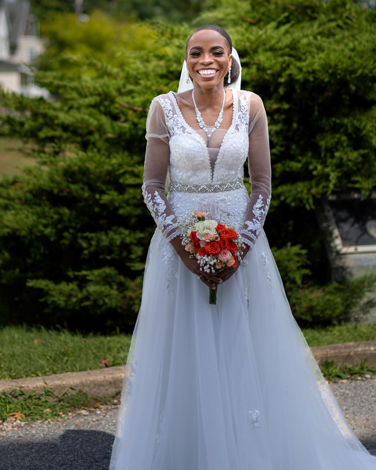 excited bride holding flowers before wedding ceremony