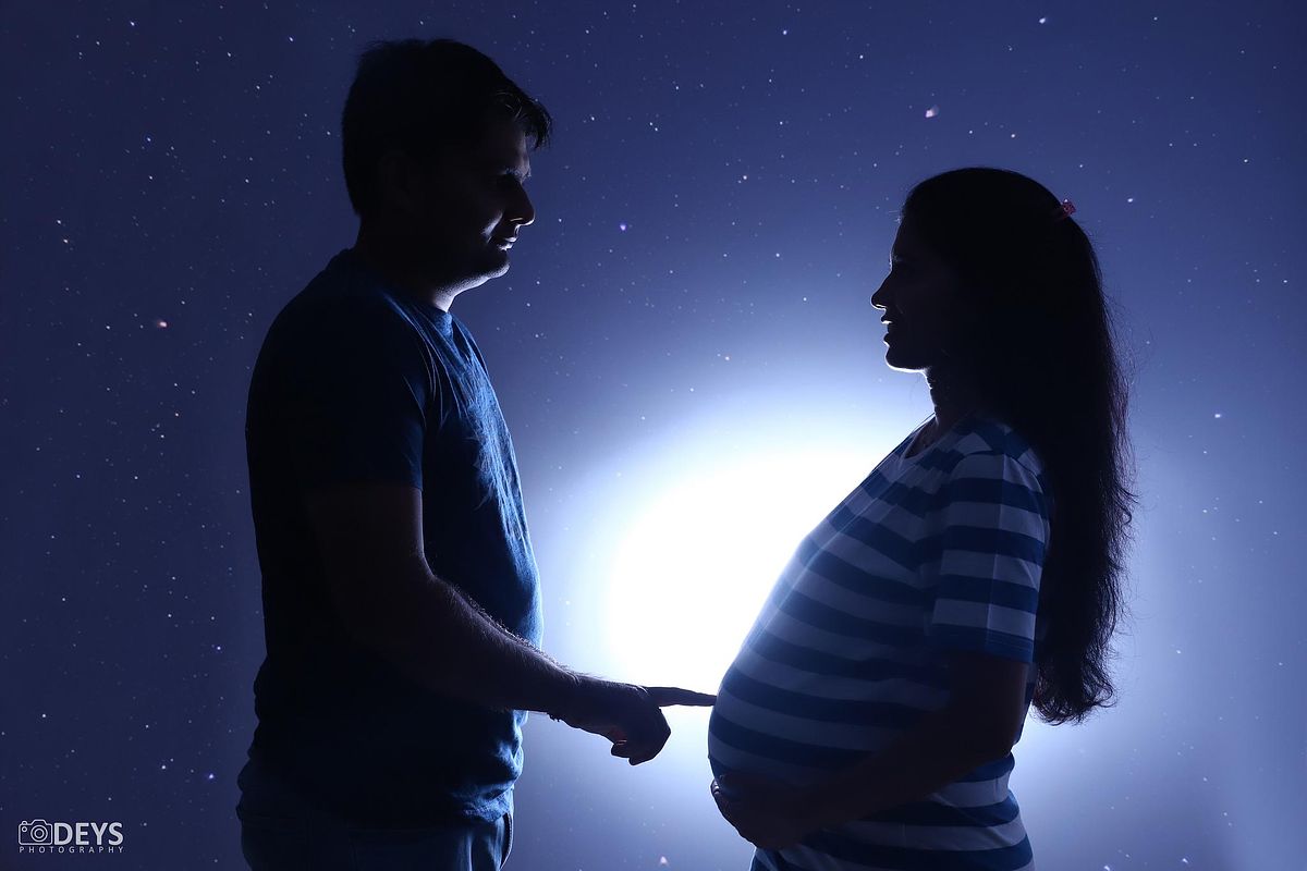 Silhouette couple maternity photoshoot near me