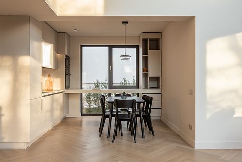 Kitchen design bathed in warm afternoon light, creating a cozy atmosphere &ndash; Faget project