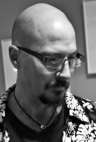 Black and white photo of jewelry designer Chris Lann