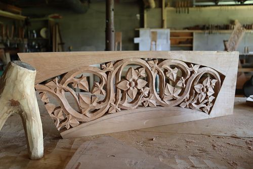 carving in process in a panel before the outer arch is carved