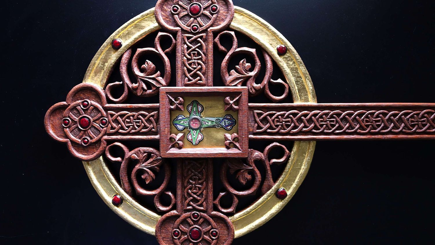 Beautifully carved leaves and knotwork and roundels on a reliquary for the True Cross for St Patrick Catholic Church in London, Ohio