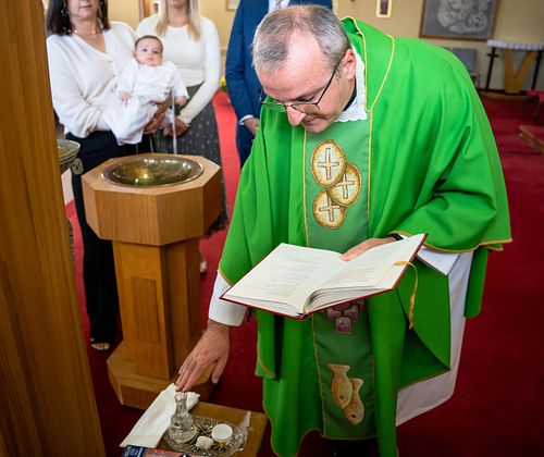 Ottawa Catholic baptism photographer capturing emotional moments