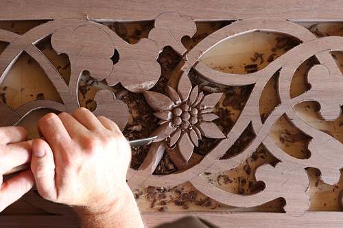 Edelweiss flower being carved by hand in walnut