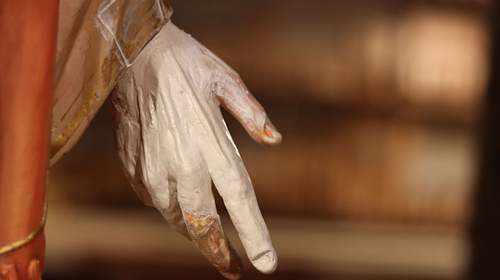 Badly broken hand on the Sacred Heart Statue during the repair process