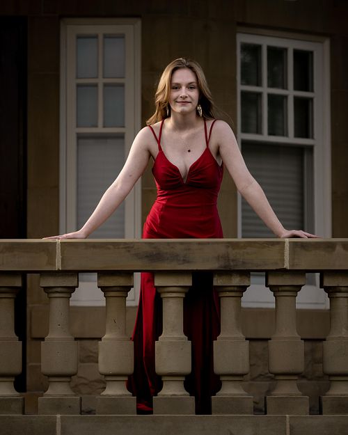 Edmonton Grad looking like a boss lady in her red gown at Government House.