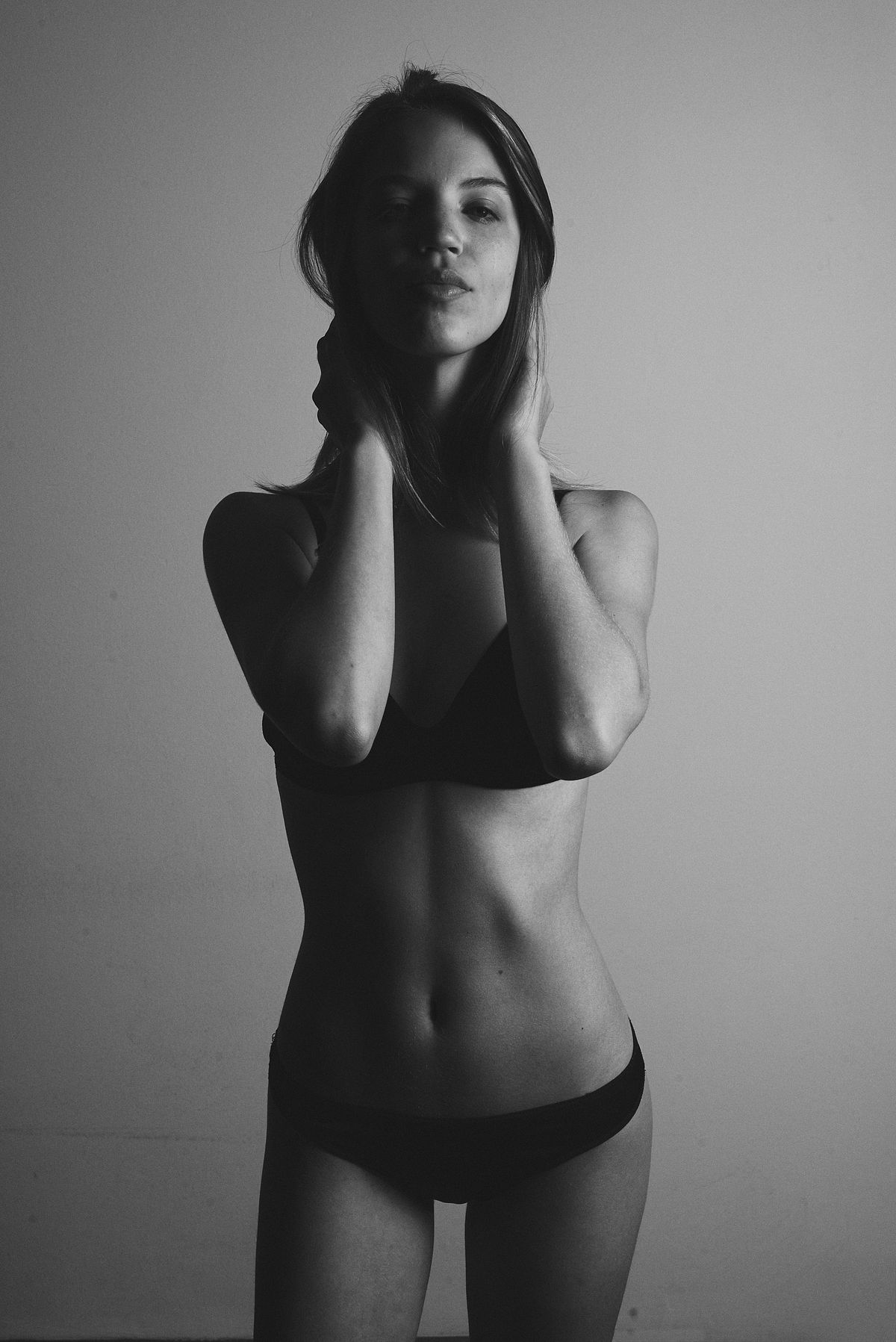 Black and White shot test polaroid style of a beautiful girl in bikini with half a body in shade, shot by Gabriel Matula.