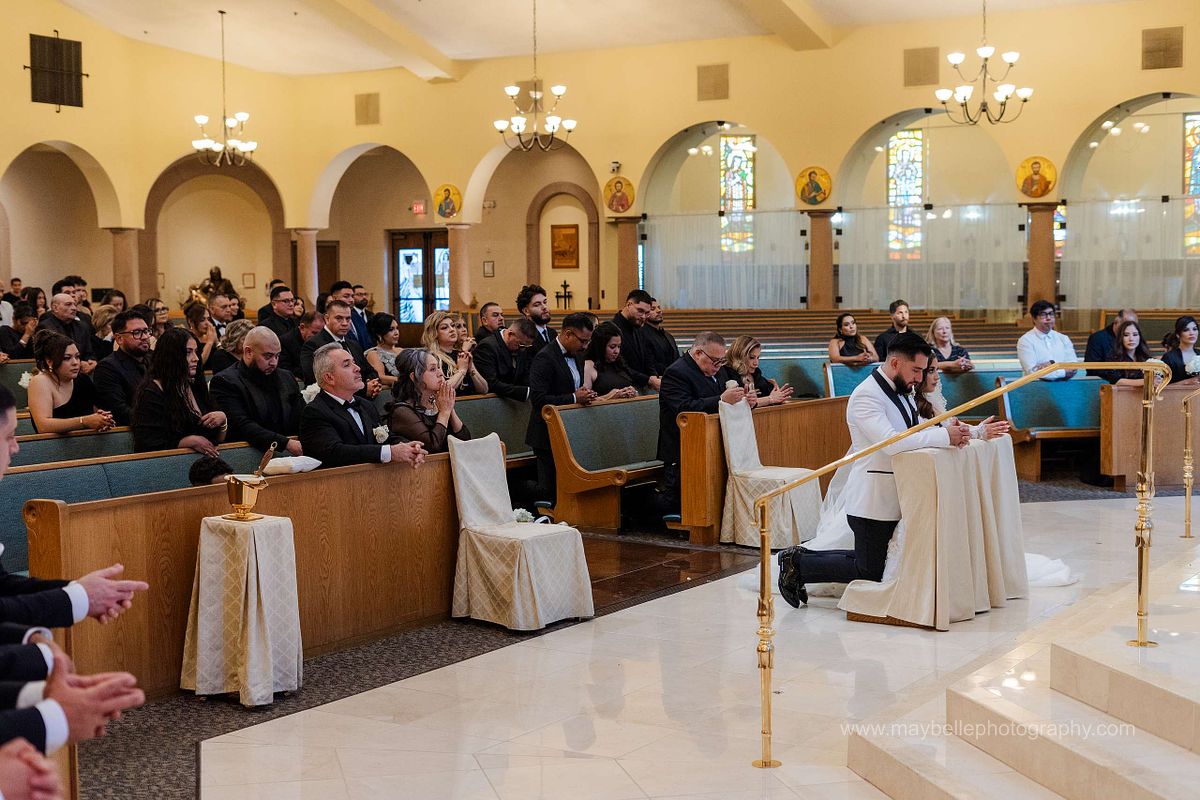 Exchanging vows at Saint Joseph, Husband of Mary Roman Catholic Church in Las Vegas Wedding Photography