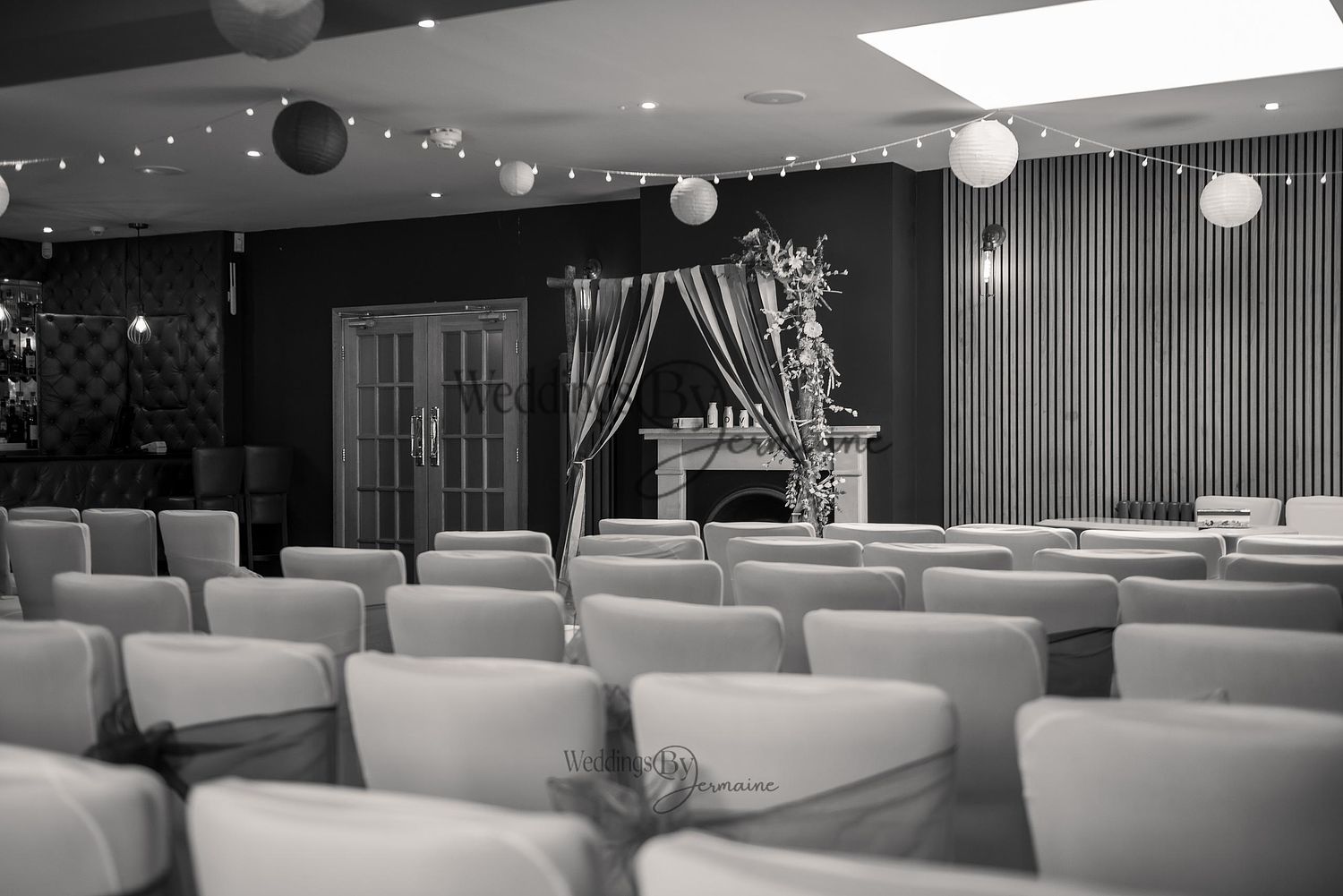 Black and white photo of the empty ceremony room at The Chequers Inn, Woolsthorpe, captured by Weddings by Jermaine just before the wedding ceremony