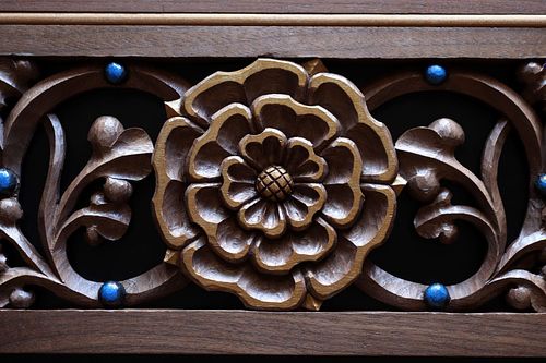 Hand-carved rose in walnut with gold and blue paint for gradine candle shelf by Wes Baker of Contrasts Woodcarving
