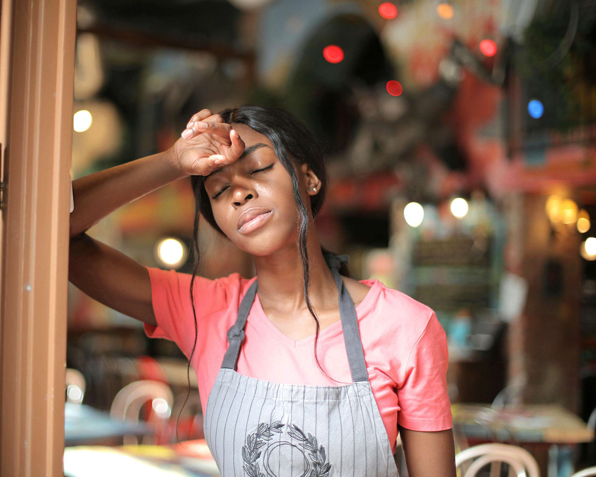 exhausted woman with menopause hot flash