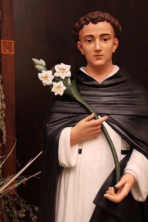 Exquisitely beautiful statue restoration of St. Dominic with custom, hand-carved lilies for Holy Trinity Catholic Church in Somerset, Ohio