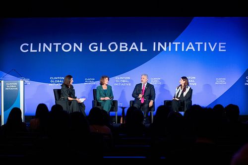 Panelists speaking on stage during a spotlight session on digital equity and education access at the 2024 Clinton Global Initiative Annual Meeting in Philadelphia, captured by professional event photographer.