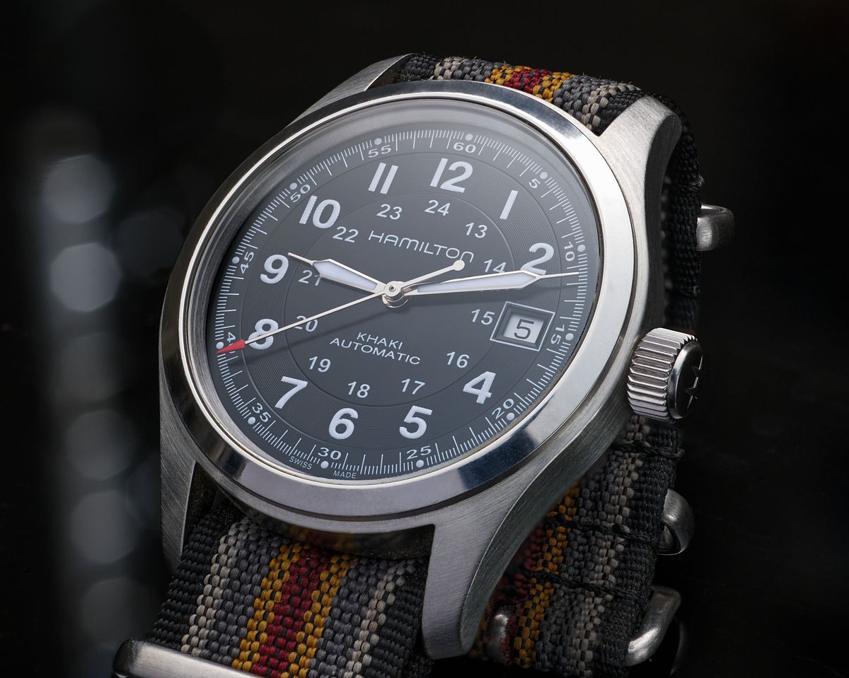 Mechanical field watch under professional lighting.