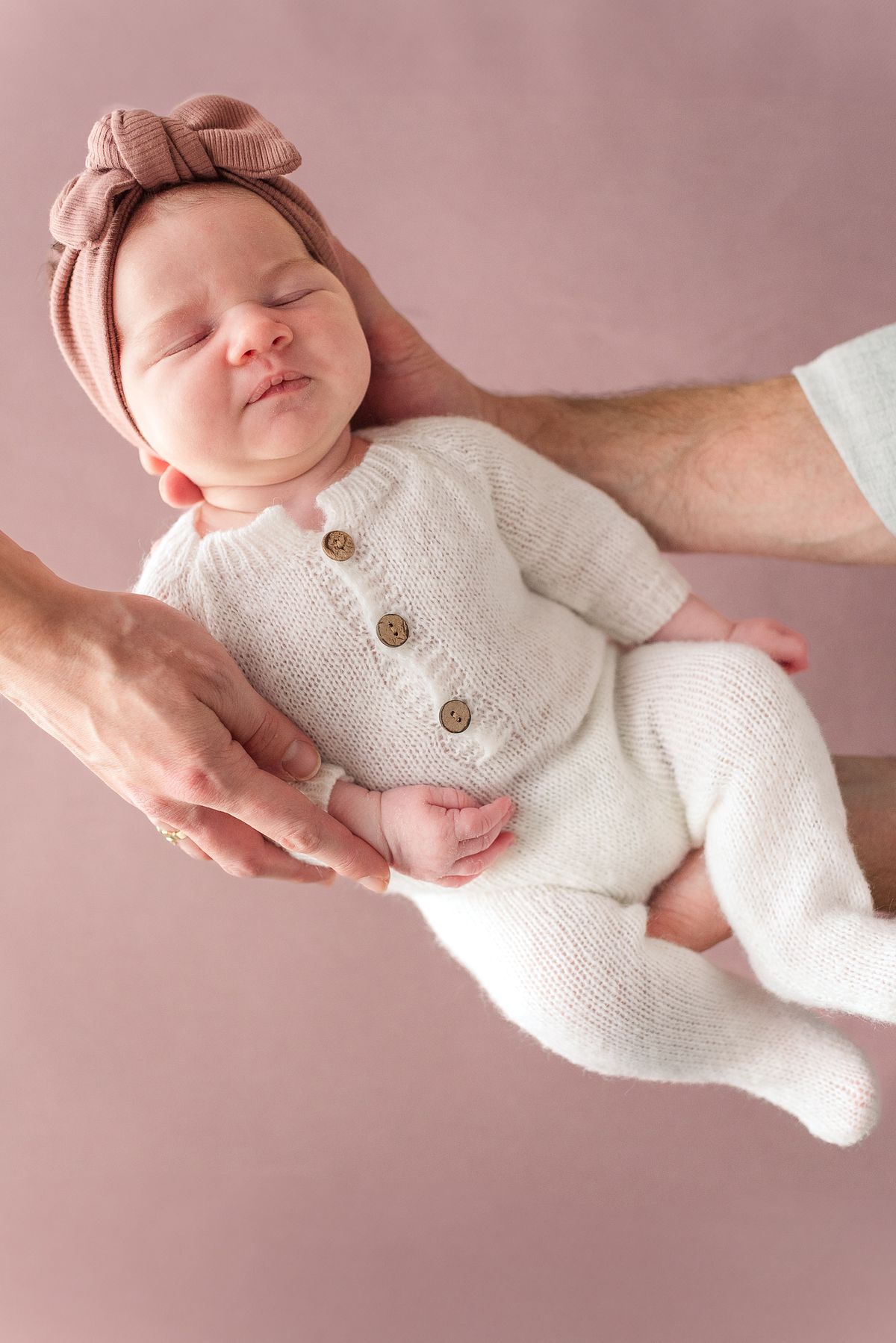 mom and dad hands holding newborn baby girl in natural window light with cranberry township, pa newborn photographer
