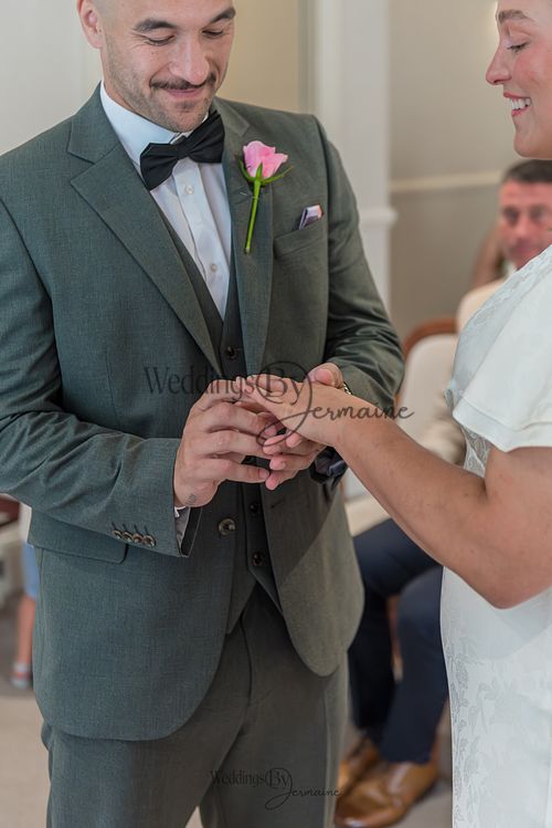 Bride-and-groom-listening-to-officiant-at-Oakham-Registry-Office