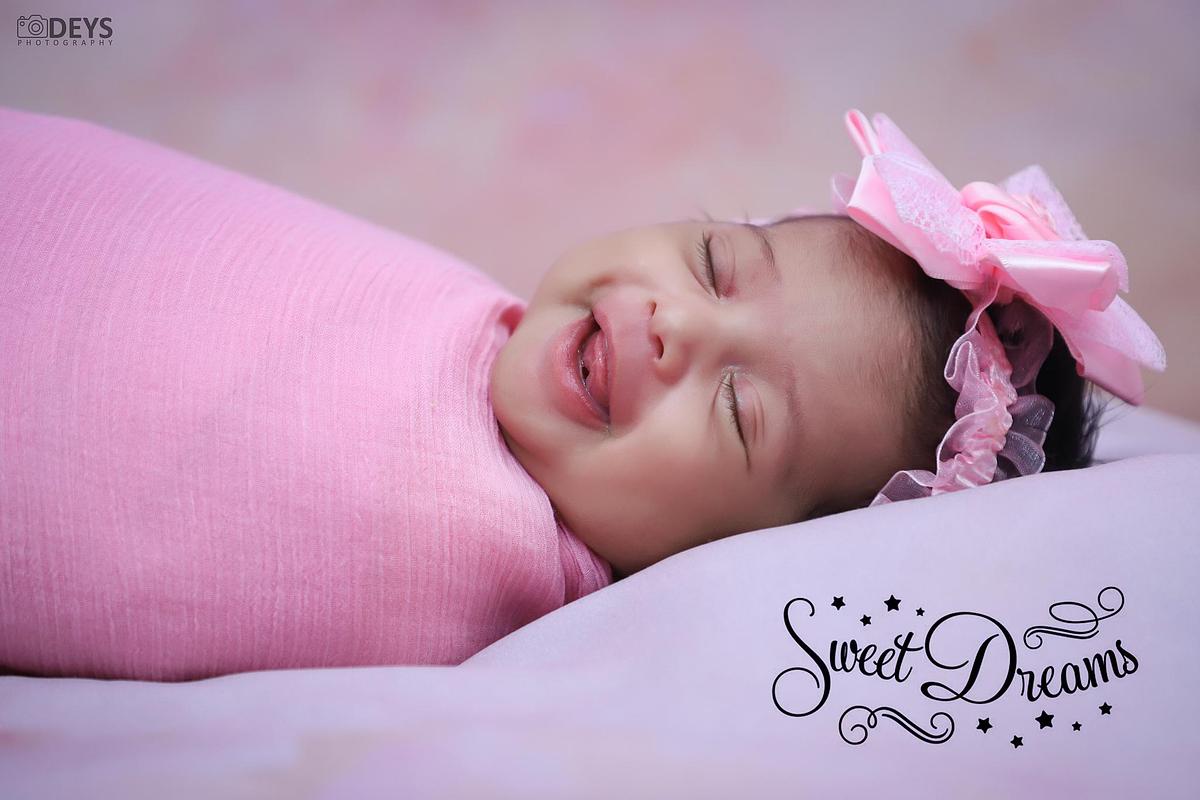 Smiling newborn baby shoot at home