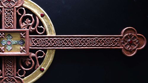 close up picture of the carving on the reliquary after stain and gilding
