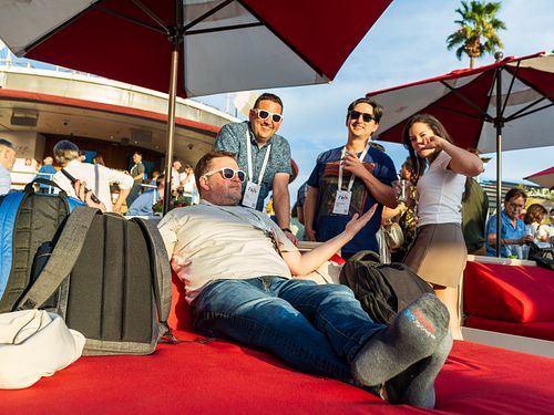 Event photo of a speaker interacting with guests at the Google after party — captured by David Andrade, Las Vegas